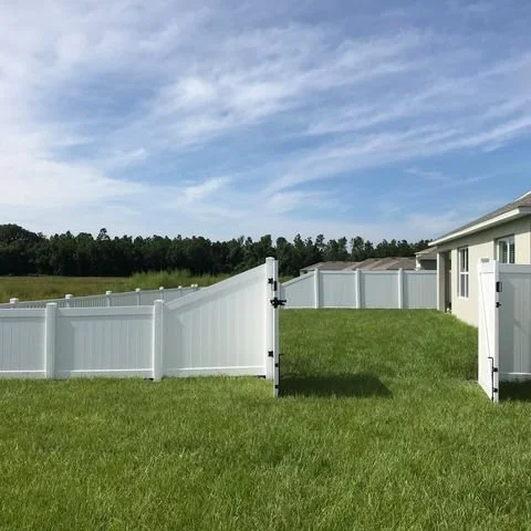 wooden vinyl fence around a house