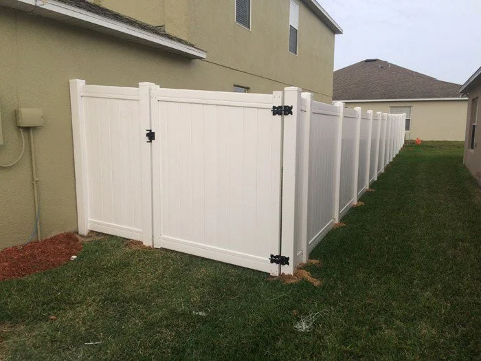 wooden vinyl aluminum fence around a house