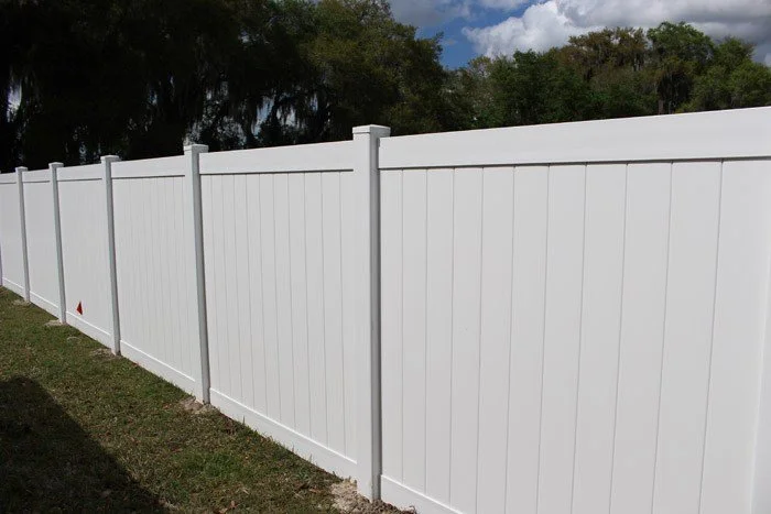 wooden vinyl fence around a house