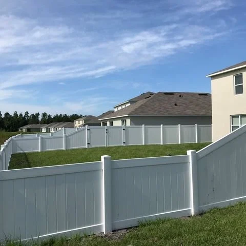 wooden vinyl aluminum fence around a house