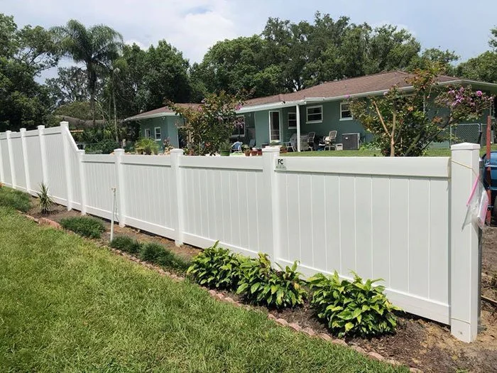 wooden vinyl aluminum fence around a house