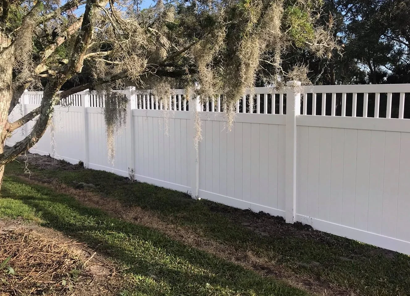 wooden vinyl fence around a house