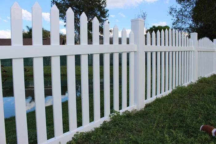 wooden vinyl aluminum fence around a house