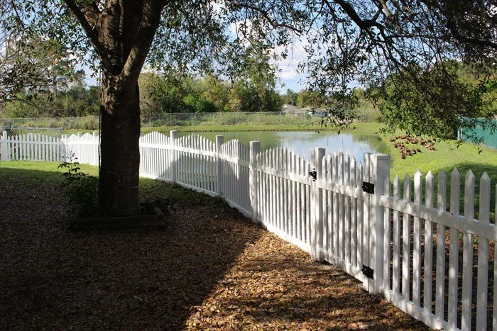 wooden vinyl aluminum fence around a house