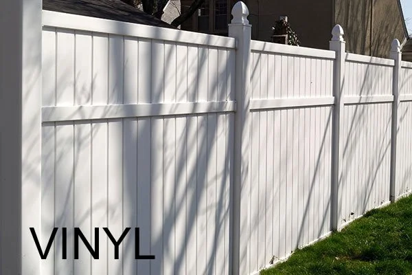 wooden vinyl aluminum fence around a house