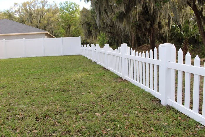 wooden vinyl fence around a house