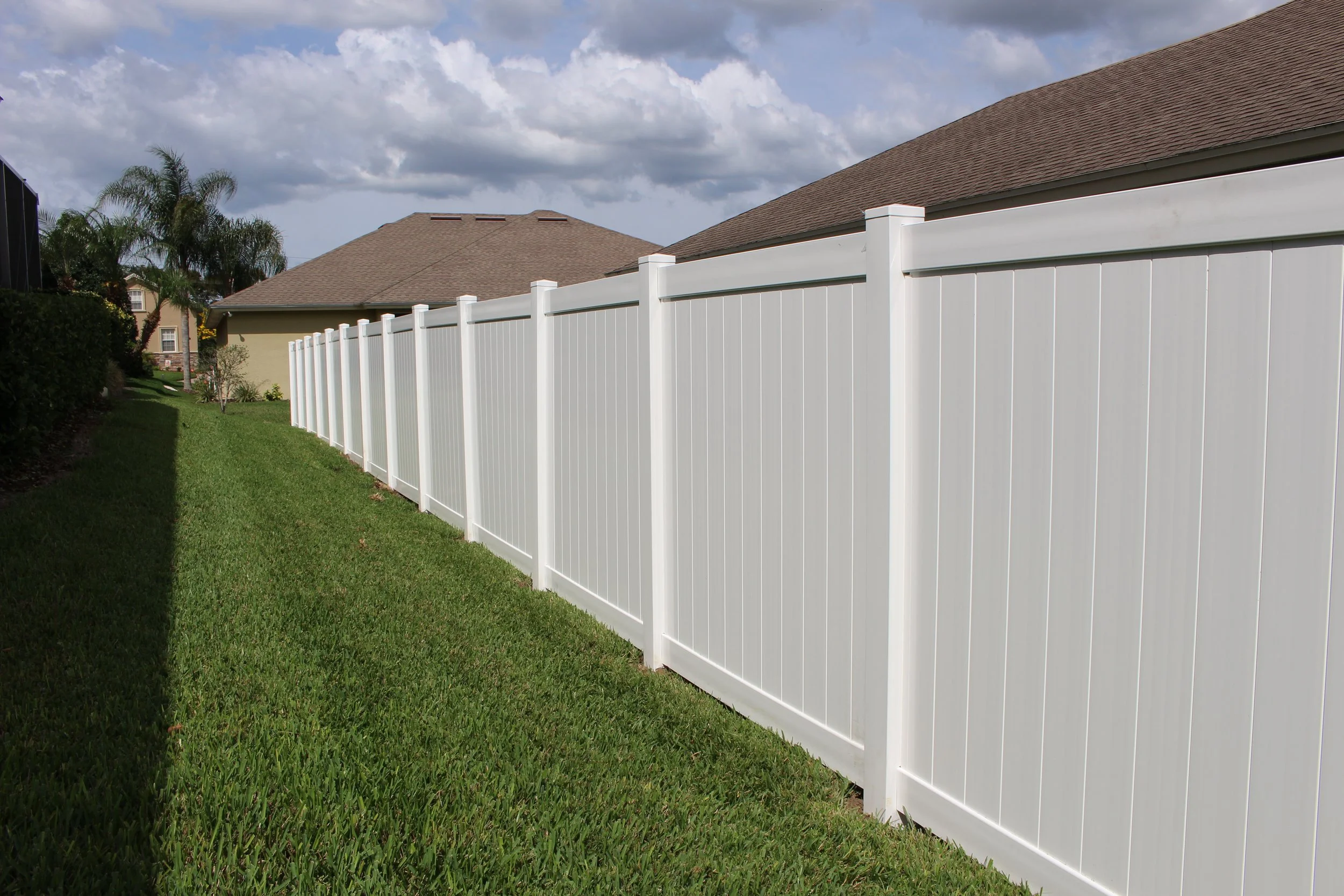 wooden vinyl aluminum fence around a house