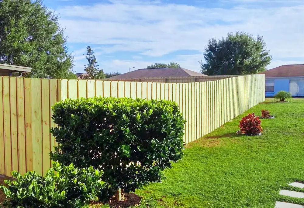Wood privacy fence surrounding a residential backyard
